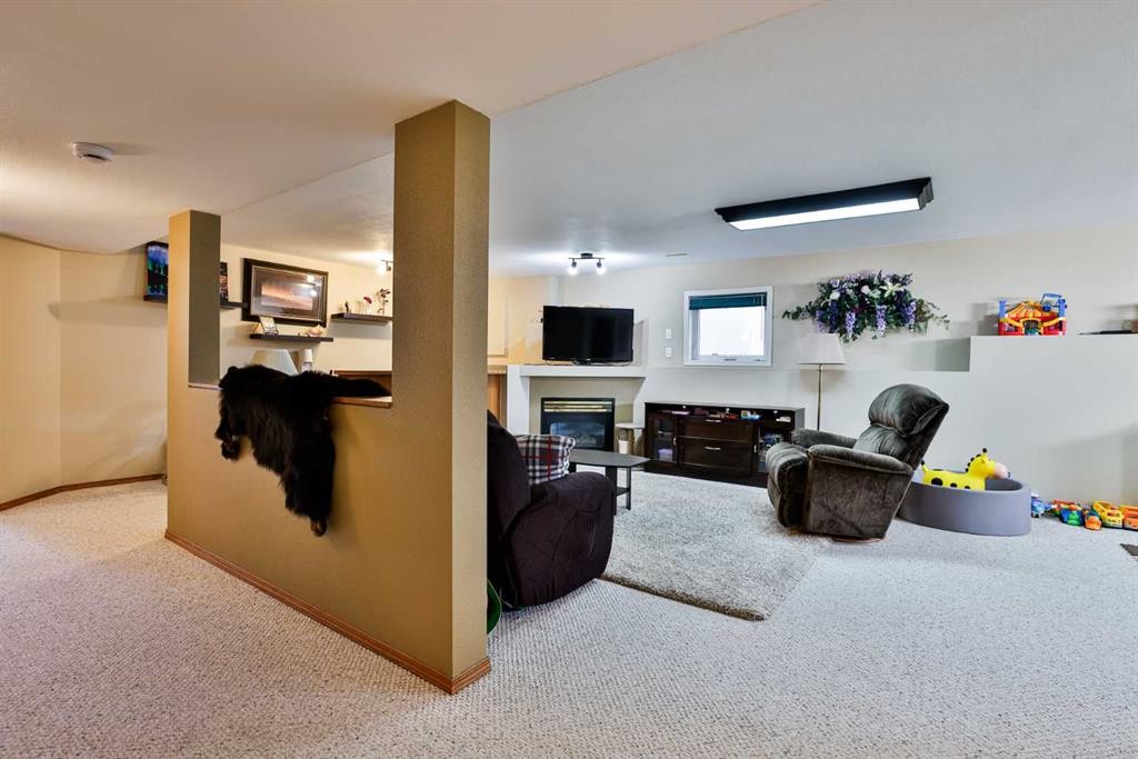 263 Red Crow Boulevard West, Lethbridge, AB - Indoor With Fireplace