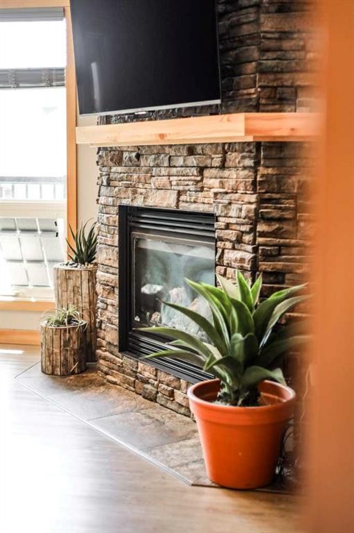 75 Ironstone Drive, Coleman, AB - Indoor Photo Showing Living Room With Fireplace