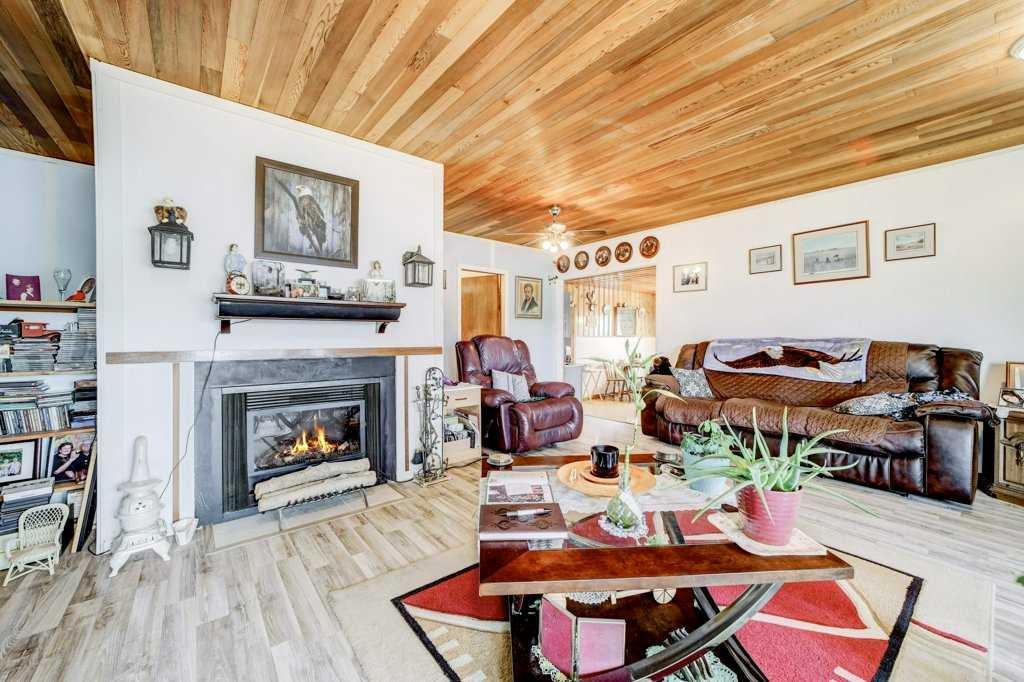 379N 300 E, Raymond, AB - Indoor Photo Showing Living Room With Fireplace