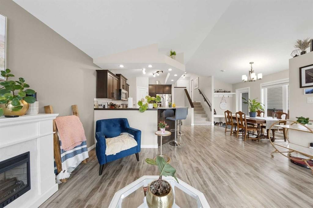 389 Moonlight Way West, Lethbridge, AB - Indoor Photo Showing Other Room With Fireplace