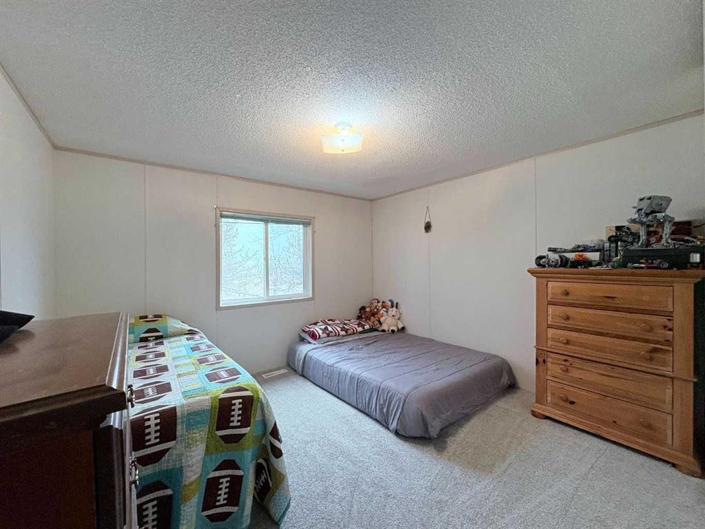 On 252 Range, Rural Cardston County, AB - Indoor Photo Showing Bedroom