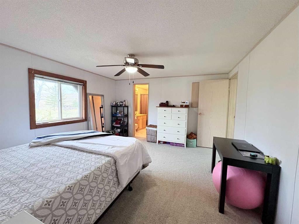 On 252 Range, Rural Cardston County, AB - Indoor Photo Showing Bedroom