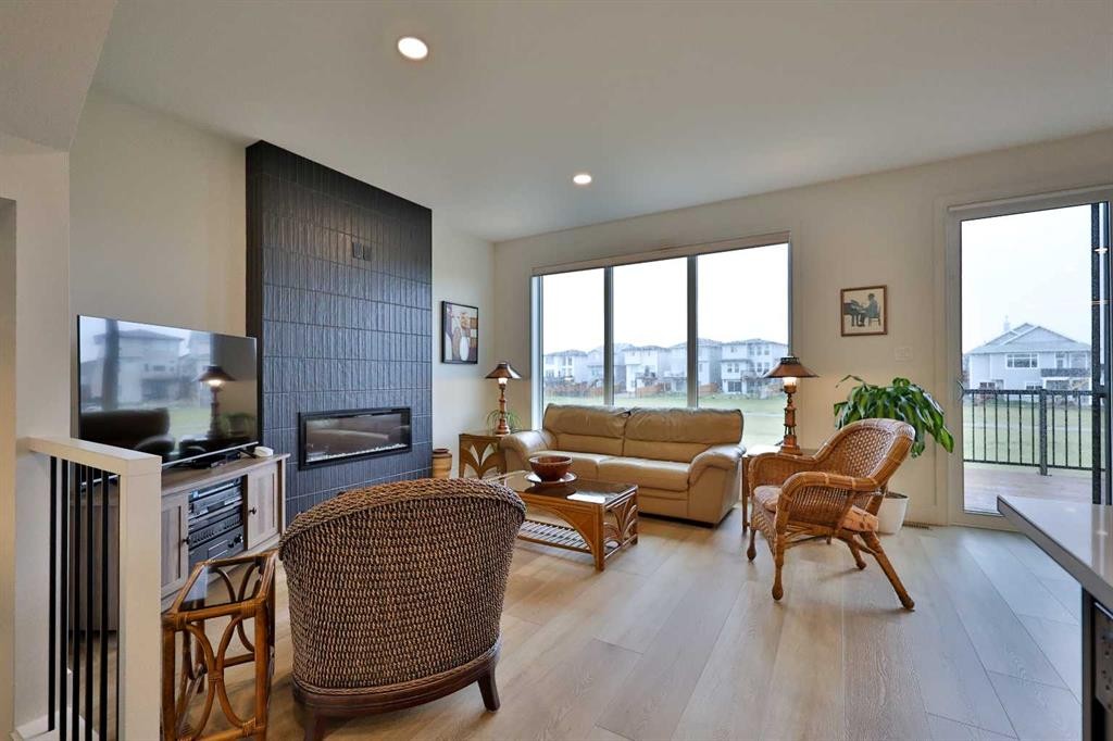 42 Blackwolf Pass North, Lethbridge, AB - Indoor Photo Showing Living Room With Fireplace