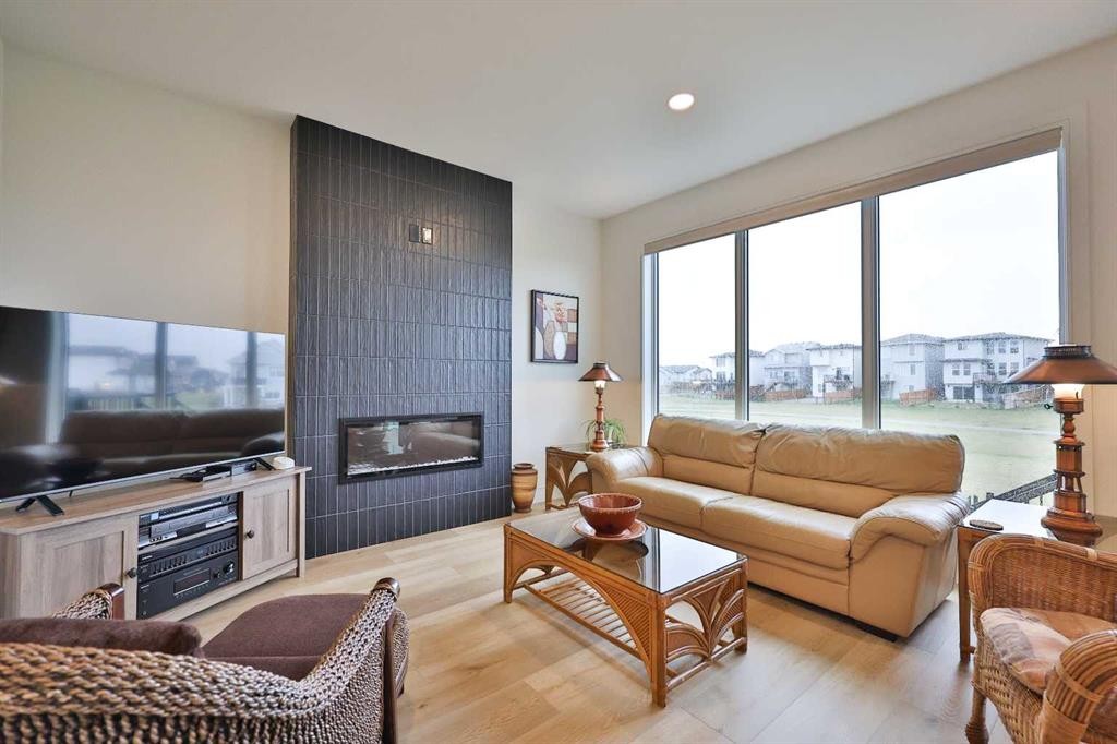 42 Blackwolf Pass North, Lethbridge, AB - Indoor Photo Showing Living Room With Fireplace