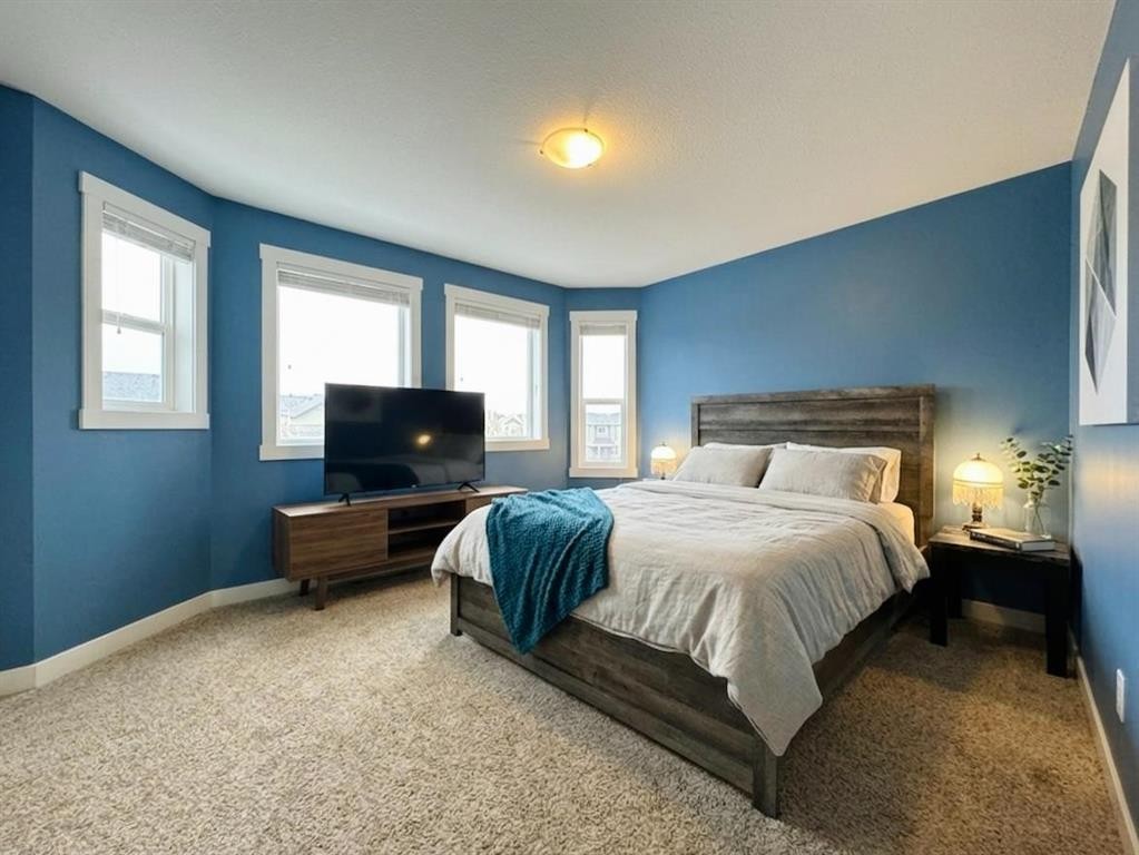 86 Riverstone Boulevard West, Lethbridge, AB - Indoor Photo Showing Bedroom