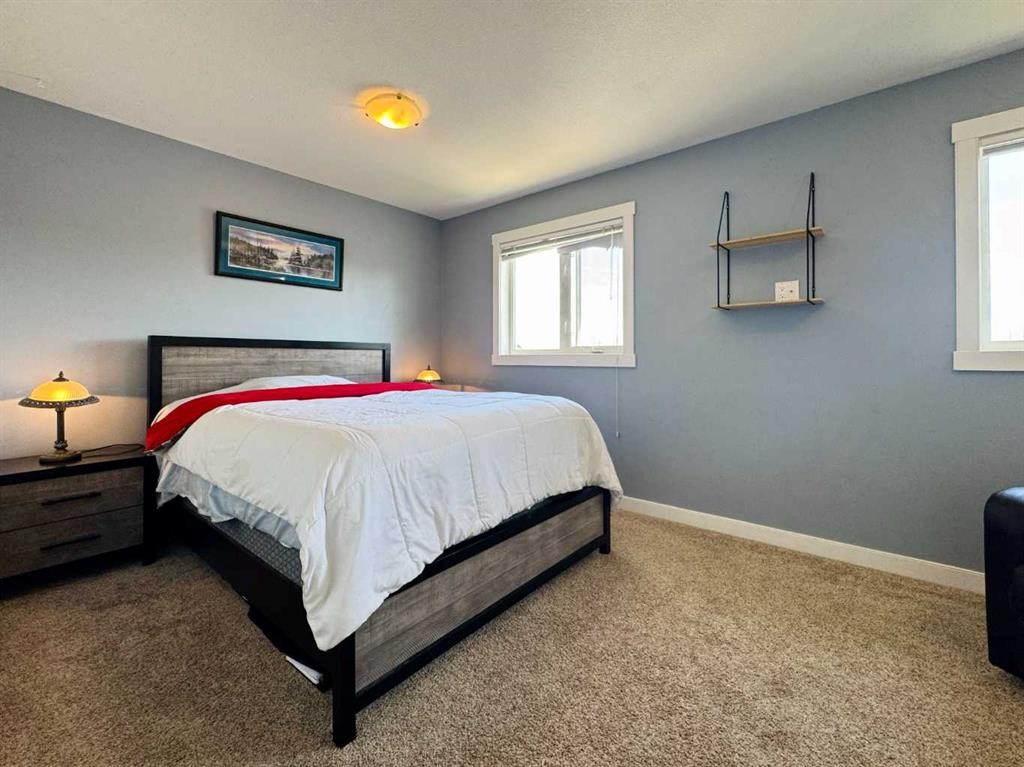 86 Riverstone Boulevard West, Lethbridge, AB - Indoor Photo Showing Bedroom