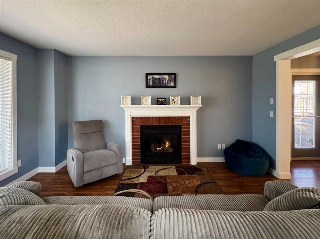 86 Riverstone Boulevard West, Lethbridge, AB - Indoor Photo Showing Living Room With Fireplace