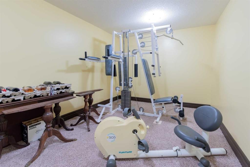 135 Garrison Drive, Fort Macleod, AB - Indoor Photo Showing Gym Room