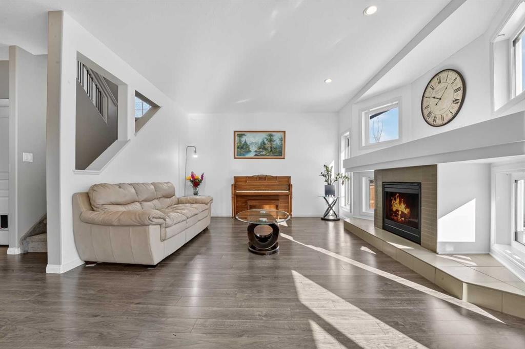 678 Twinriver Crescent West, Lethbridge, AB - Indoor Photo Showing Living Room With Fireplace