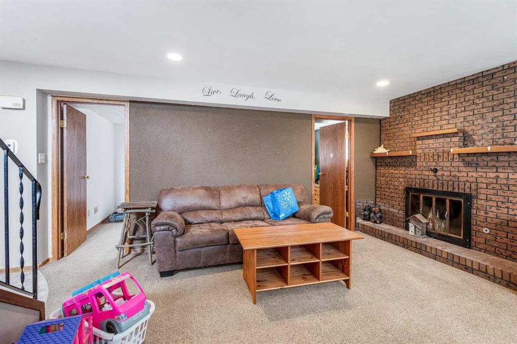 4716 Heritage Drive, Taber, AB - Indoor Photo Showing Living Room With Fireplace