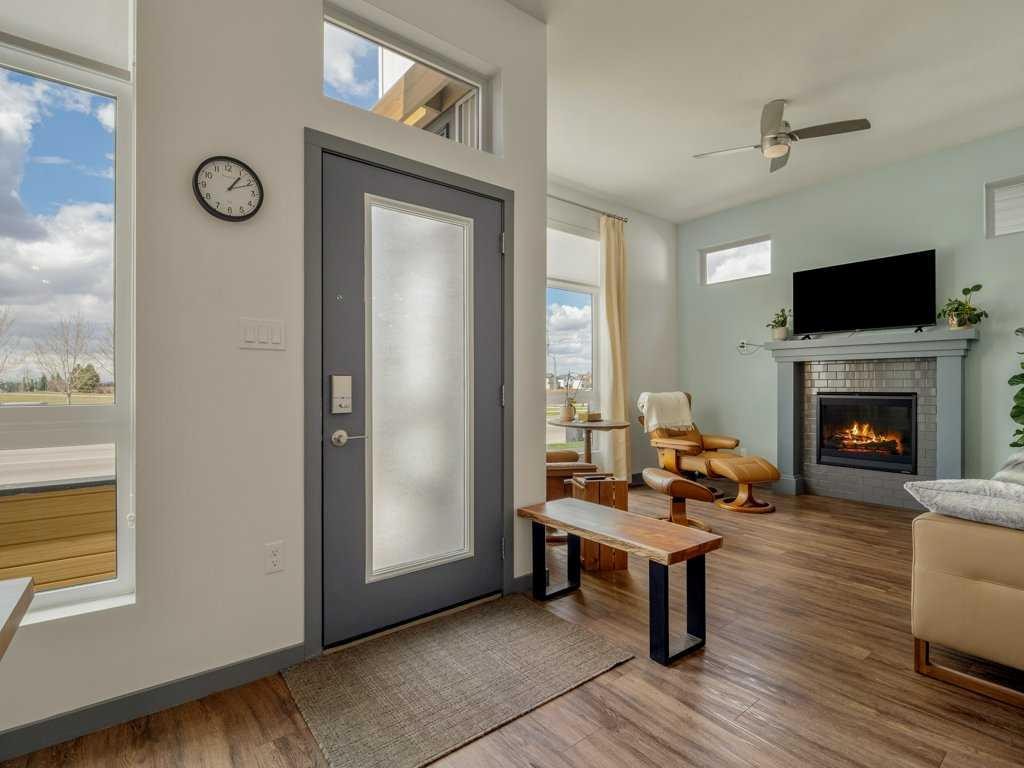 350 Uplands Boulevard North, Lethbridge, AB - Indoor Photo Showing Living Room With Fireplace
