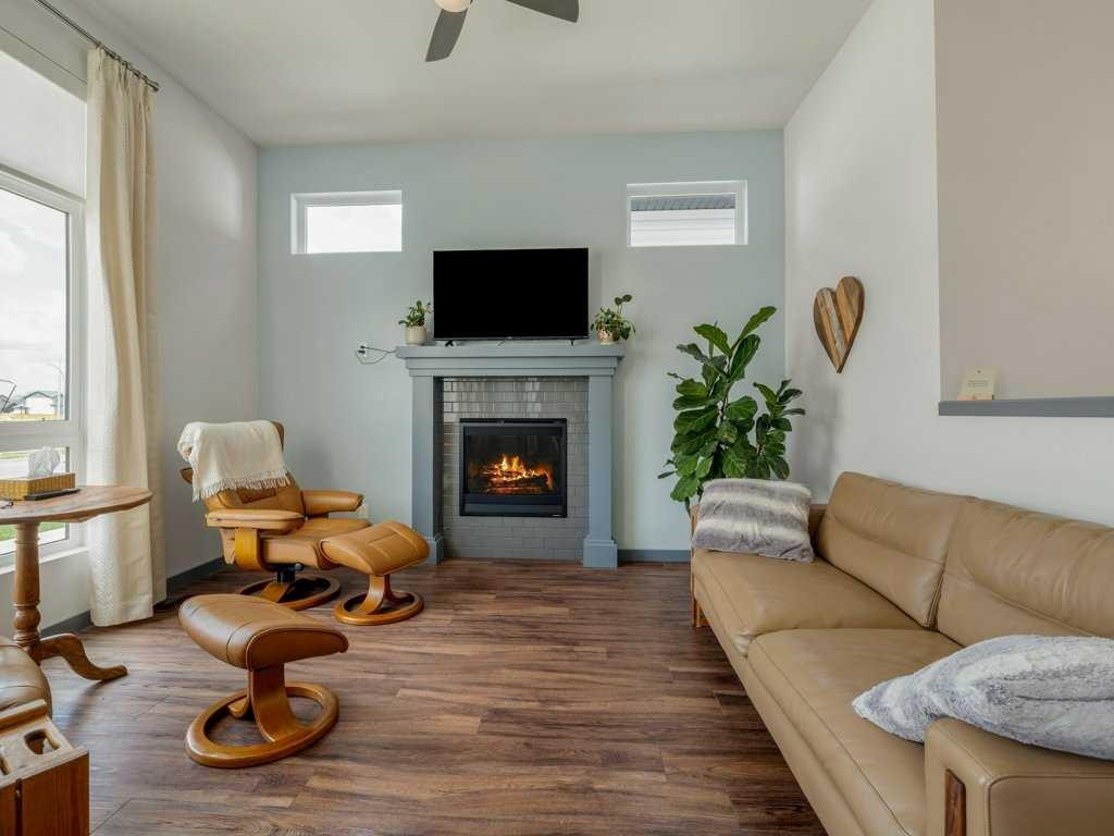 350 Uplands Boulevard North, Lethbridge, AB - Indoor Photo Showing Living Room With Fireplace
