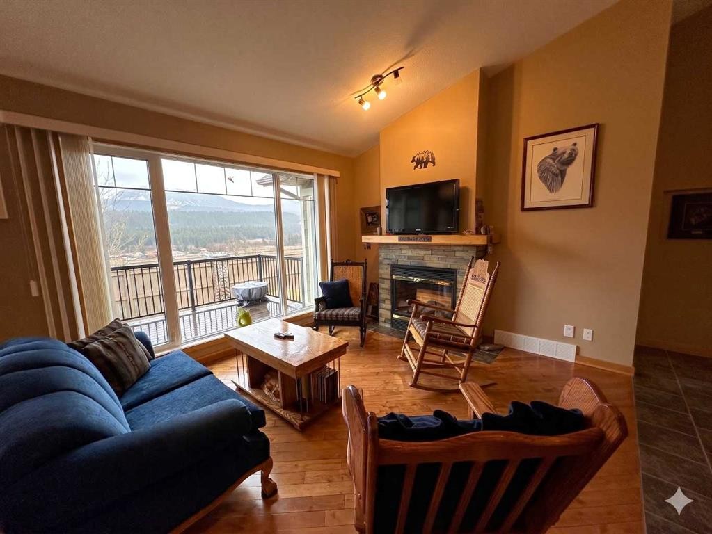 21 Ironstone Drive, Coleman, AB - Indoor Photo Showing Living Room With Fireplace