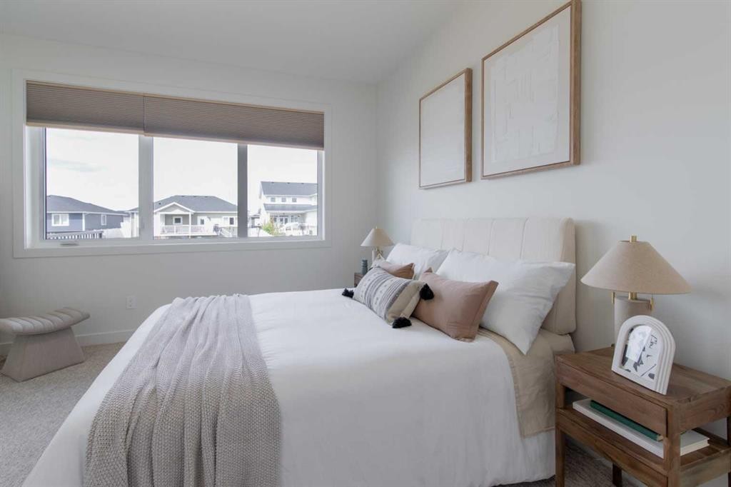 306 Bridge Crossing Close, Raymond, AB - Indoor Photo Showing Bedroom