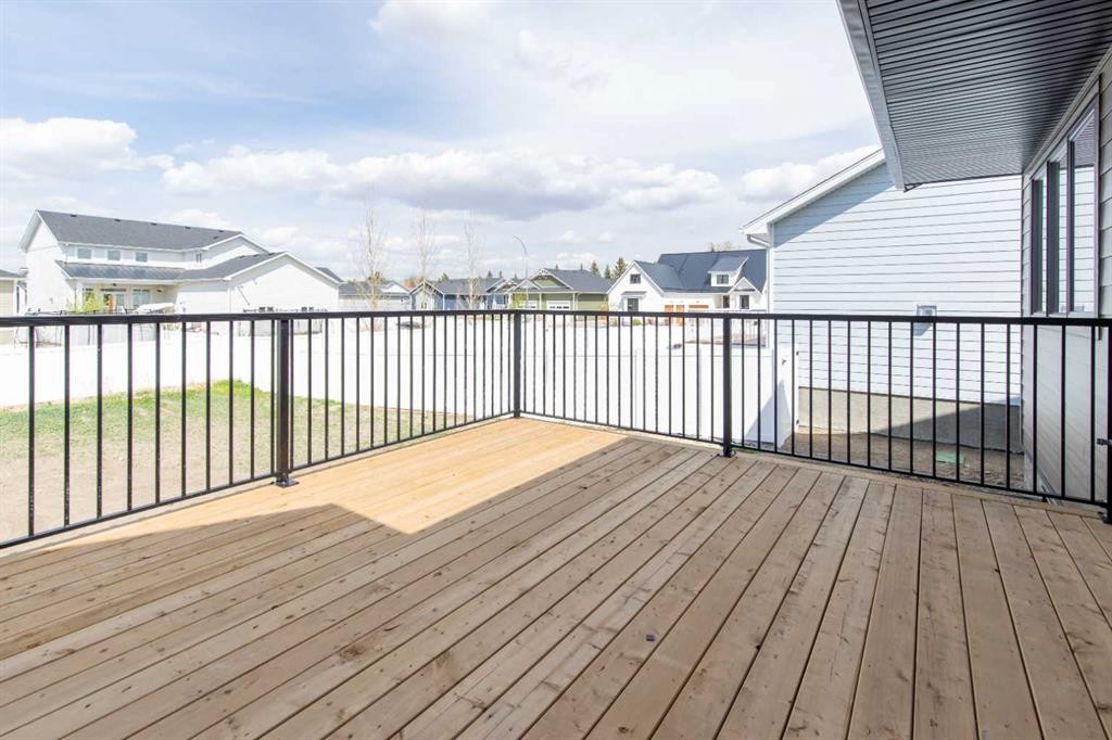 306 Bridge Crossing Close, Raymond, AB - Outdoor With Deck Patio Veranda With Exterior