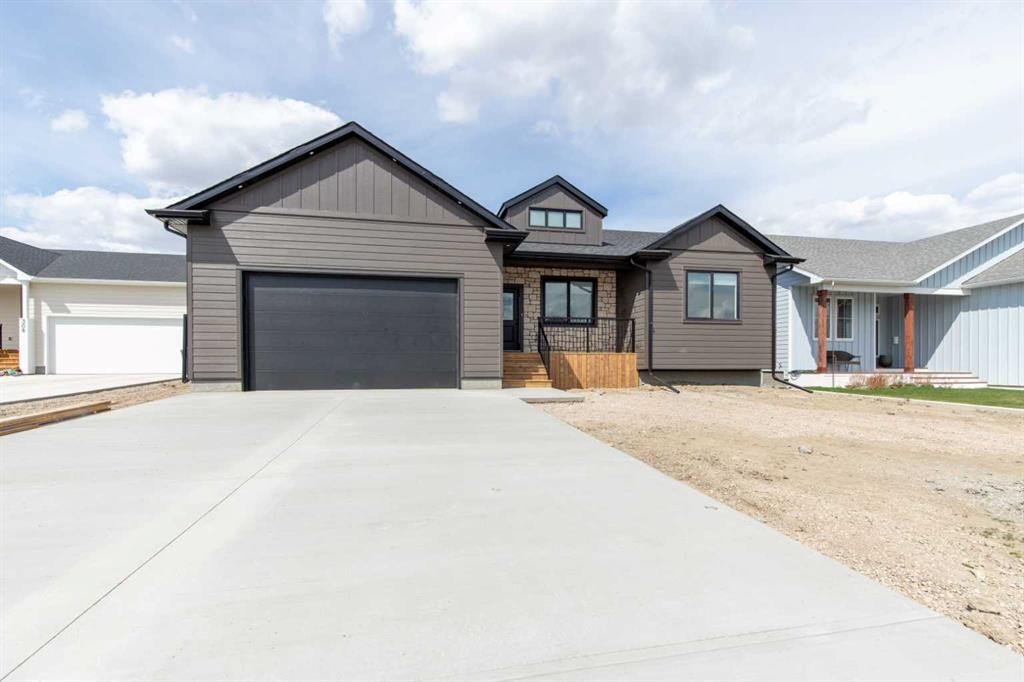 306 Bridge Crossing Close, Raymond, AB - Outdoor With Facade