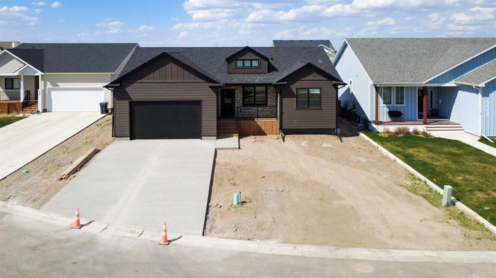 306 Bridge Crossing Close, Raymond, AB - Outdoor With Facade