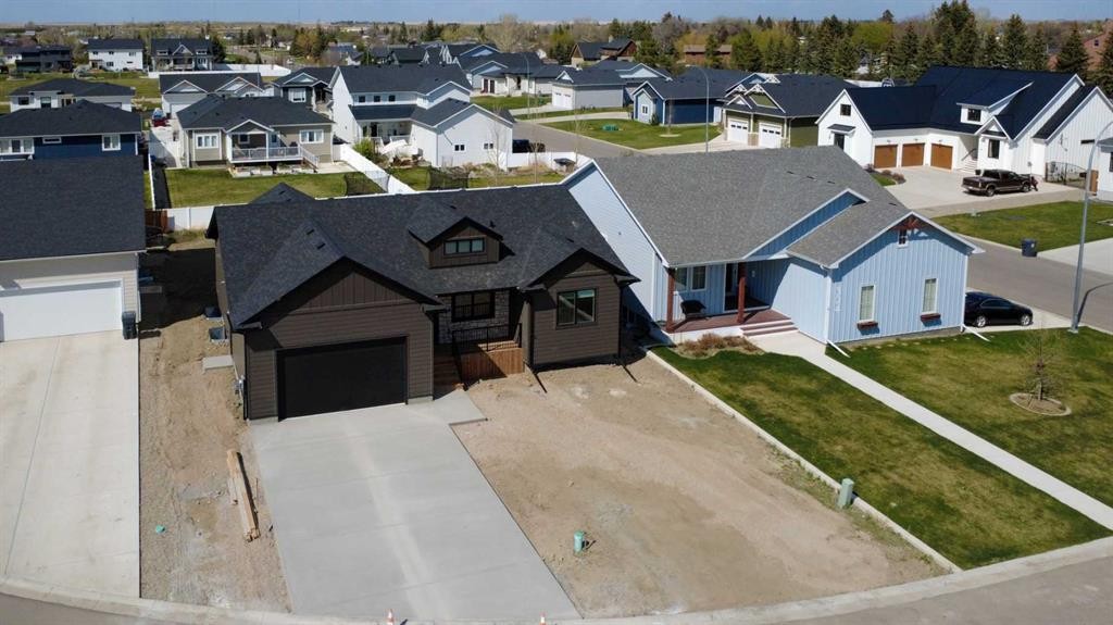 306 Bridge Crossing Close, Raymond, AB - Outdoor With Facade