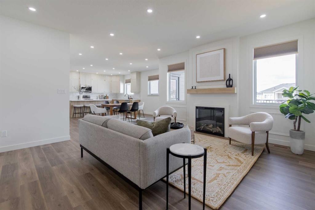 306 Bridge Crossing Close, Raymond, AB - Indoor Photo Showing Living Room With Fireplace