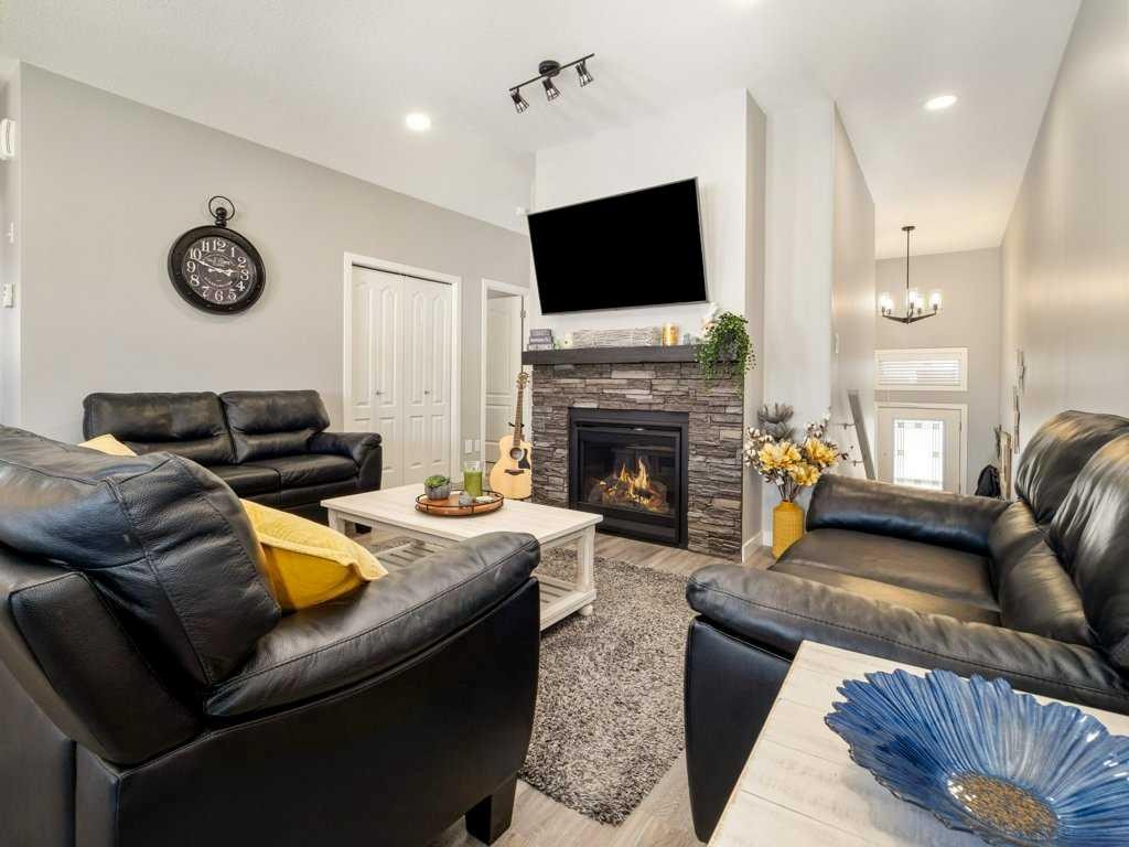 4-322 Northlander Bend West, Lethbridge, AB - Indoor Photo Showing Living Room With Fireplace