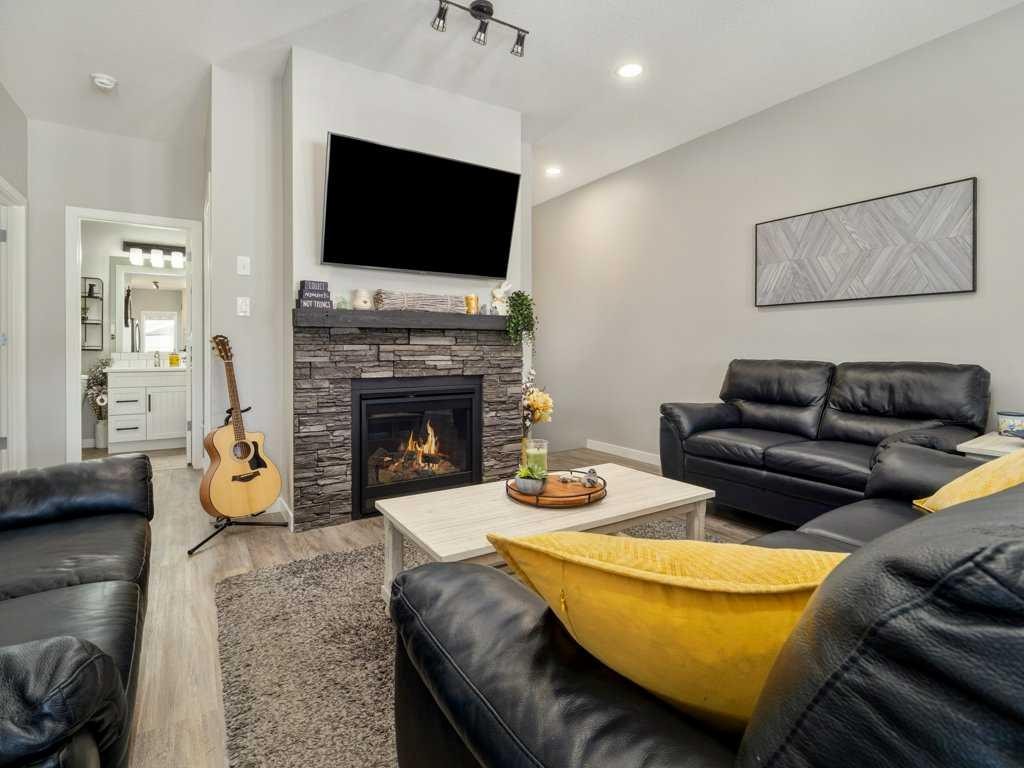 4-322 Northlander Bend West, Lethbridge, AB - Indoor Photo Showing Living Room With Fireplace