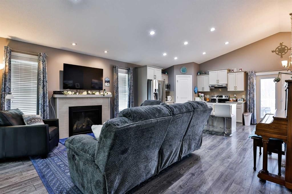 223 Couleesprings Terrace South, Lethbridge, AB - Indoor Photo Showing Living Room With Fireplace