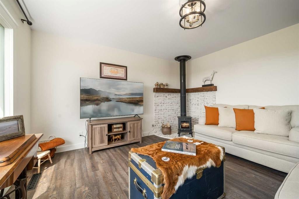 94075 Range Road 115, Burdett, AB - Indoor Photo Showing Living Room With Fireplace