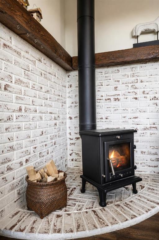 94075 Range Road 115, Burdett, AB - Indoor With Fireplace