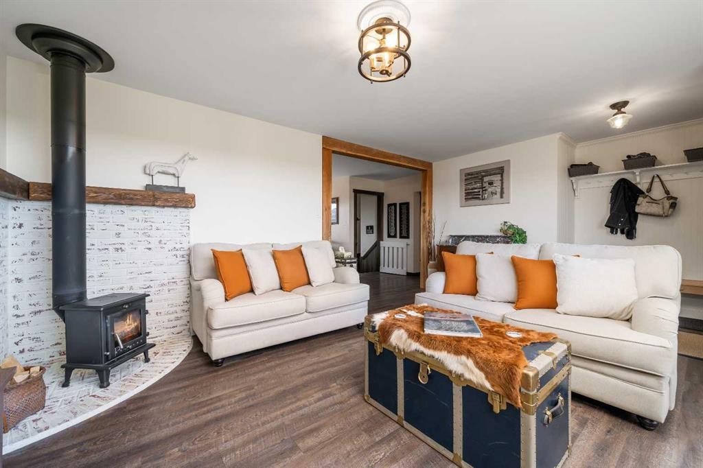 94075 Range Road 115, Burdett, AB - Indoor Photo Showing Living Room With Fireplace