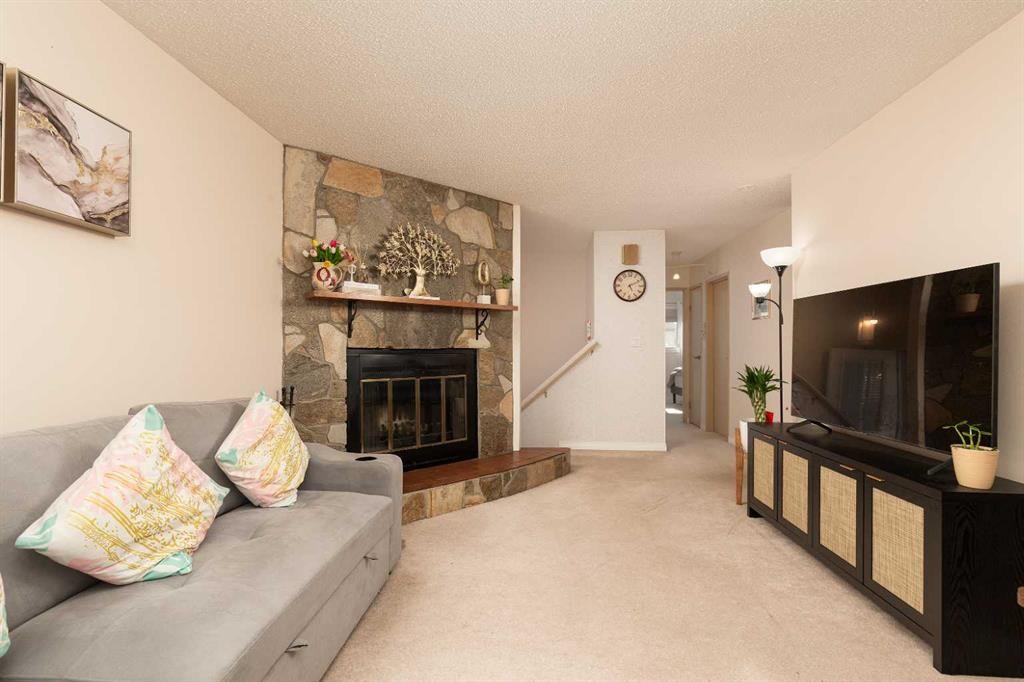 52 Trent Road West, Lethbridge, AB - Indoor Photo Showing Living Room With Fireplace