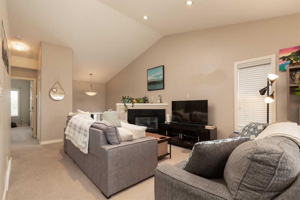 247 Blackwolf Way North, Lethbridge, AB - Indoor Photo Showing Bedroom With Fireplace