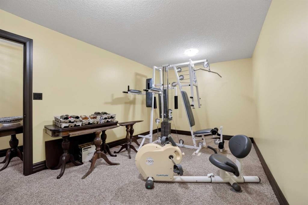 135 Garrison Drive, Fort Macleod, AB - Indoor Photo Showing Gym Room