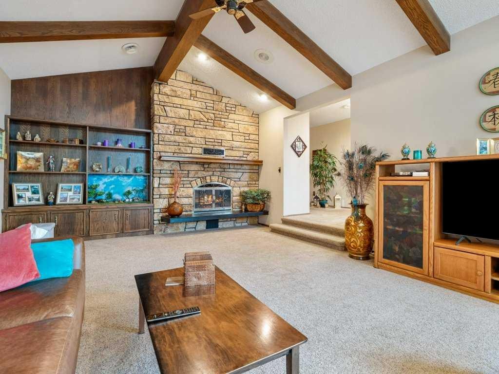 2201 21 Avenue, Coaldale, AB - Indoor Photo Showing Living Room With Fireplace