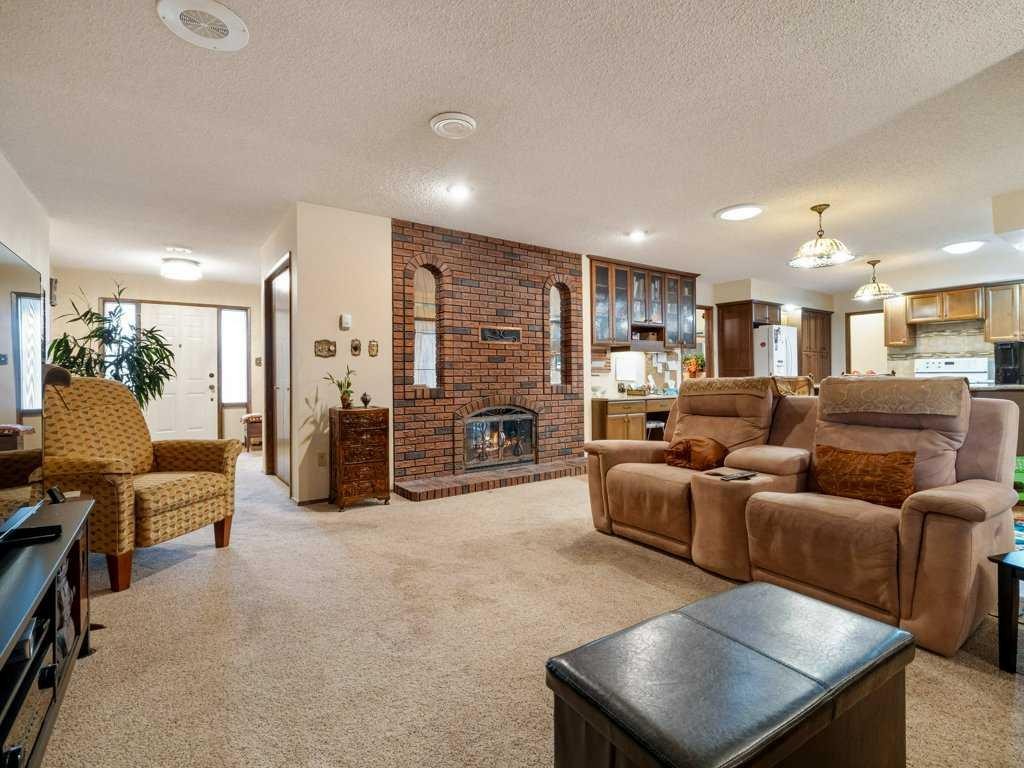 2201 21 Avenue, Coaldale, AB - Indoor Photo Showing Living Room With Fireplace