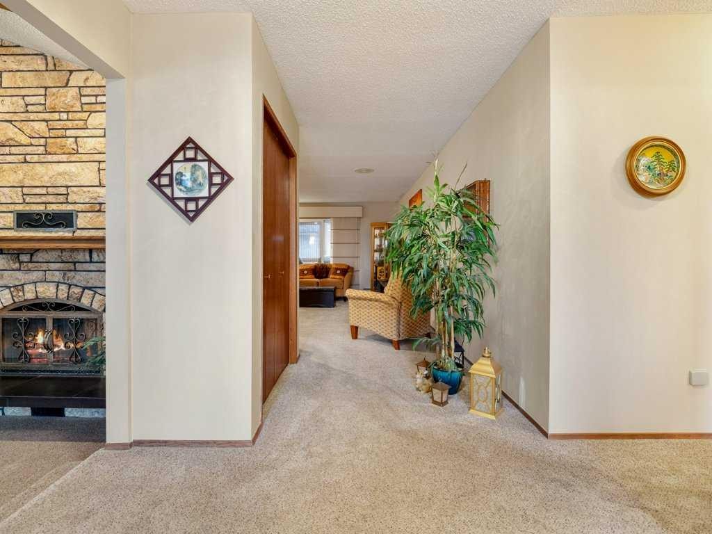 2201 21 Avenue, Coaldale, AB - Indoor Photo Showing Other Room With Fireplace