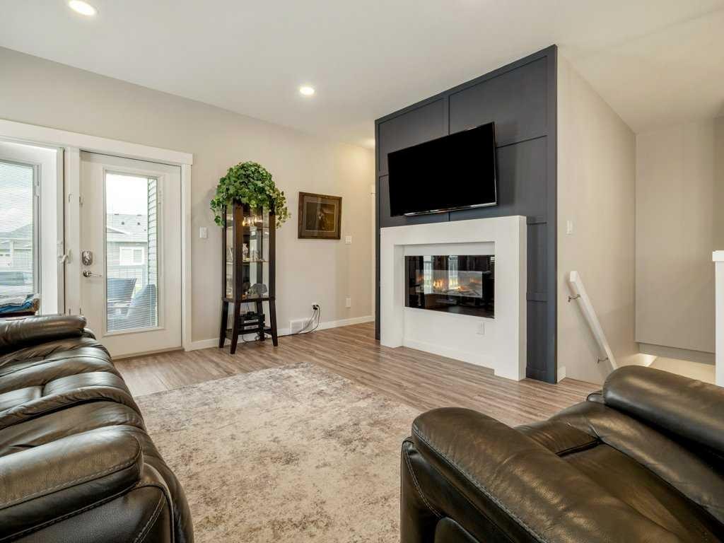1-322 Northlander Bend West, Lethbridge, AB - Indoor Photo Showing Living Room With Fireplace