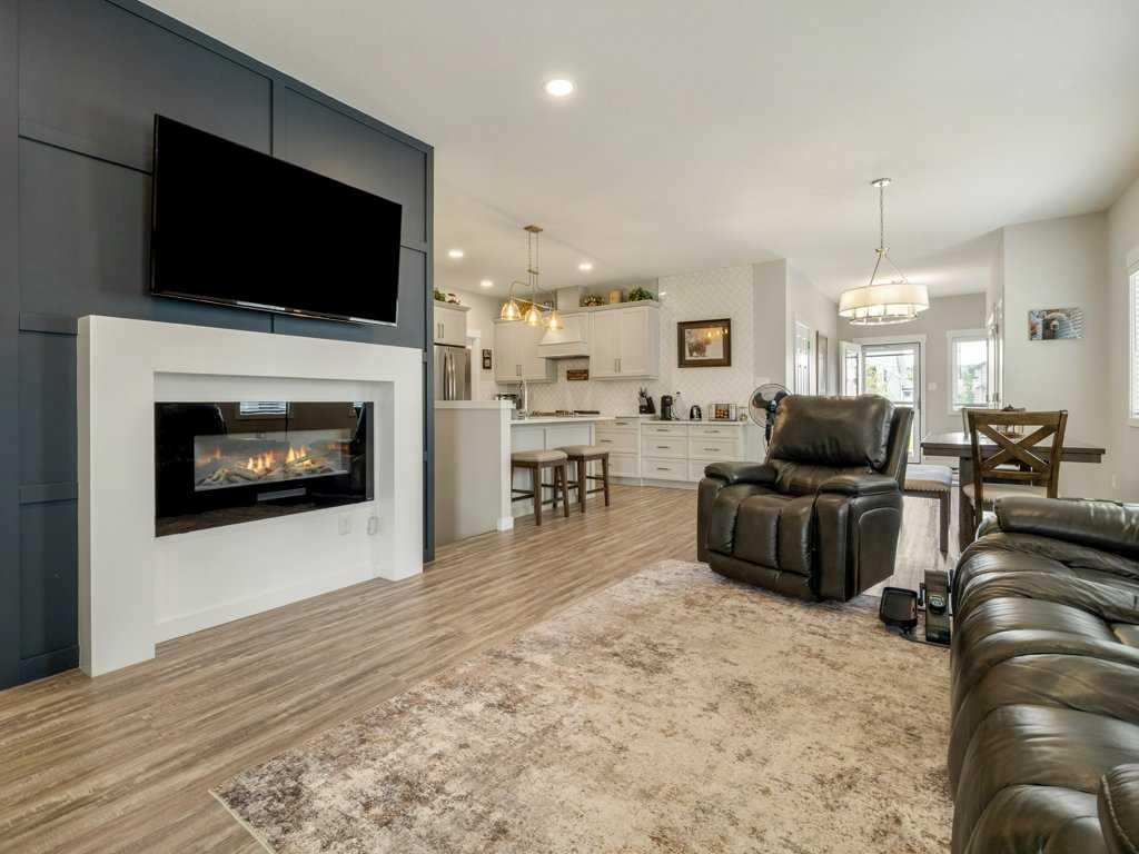 1-322 Northlander Bend West, Lethbridge, AB - Indoor Photo Showing Living Room With Fireplace