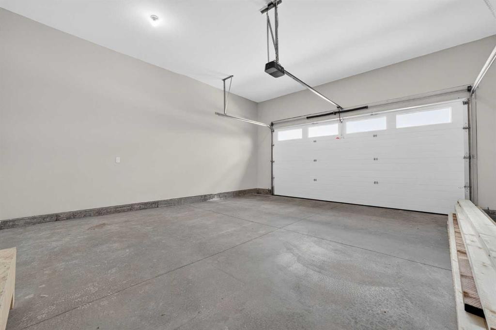 74 Riverpark Boulevard West, Lethbridge, AB - Indoor Photo Showing Garage