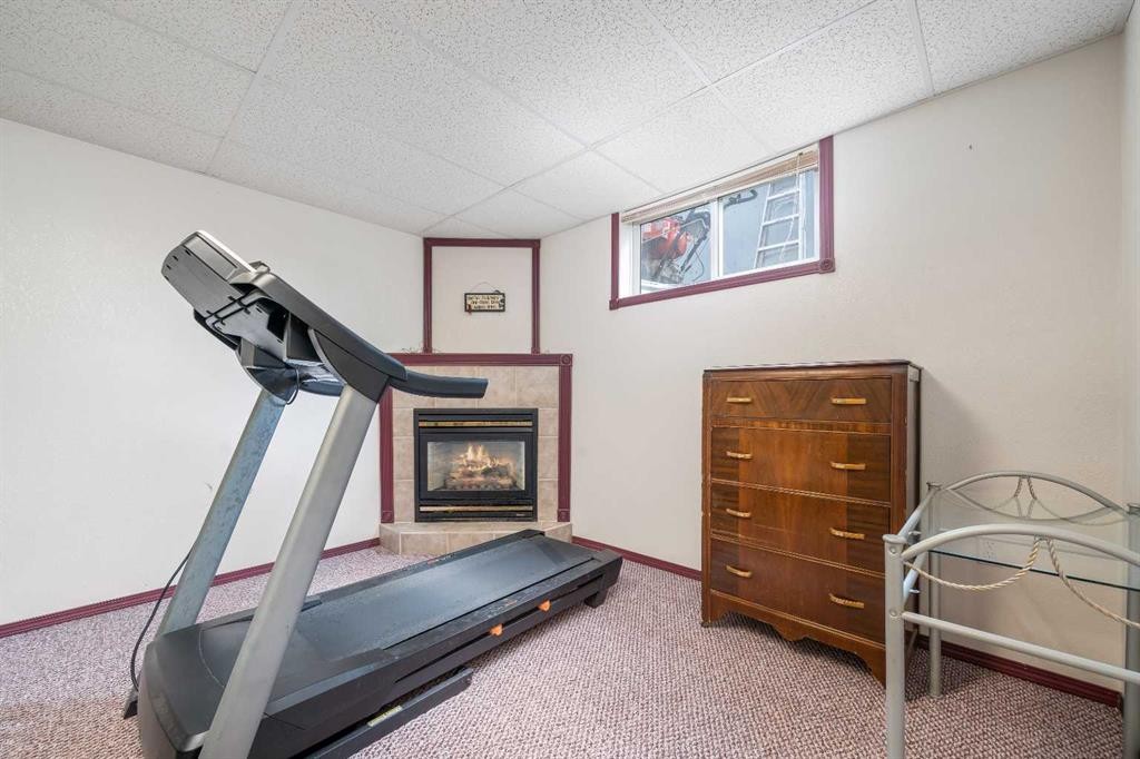 5205 55 Street, Taber, AB - Indoor Photo Showing Gym Room
