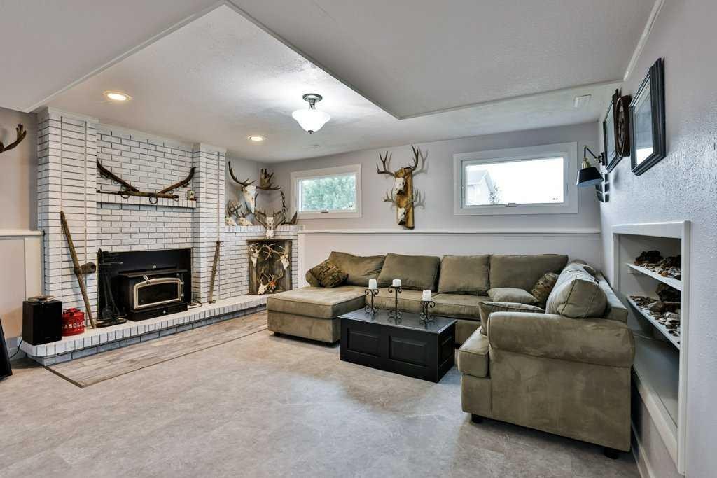 5217 38 Avenue, Taber, AB - Indoor Photo Showing Living Room With Fireplace