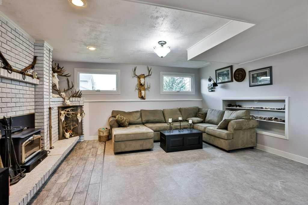 5217 38 Avenue, Taber, AB - Indoor Photo Showing Living Room With Fireplace