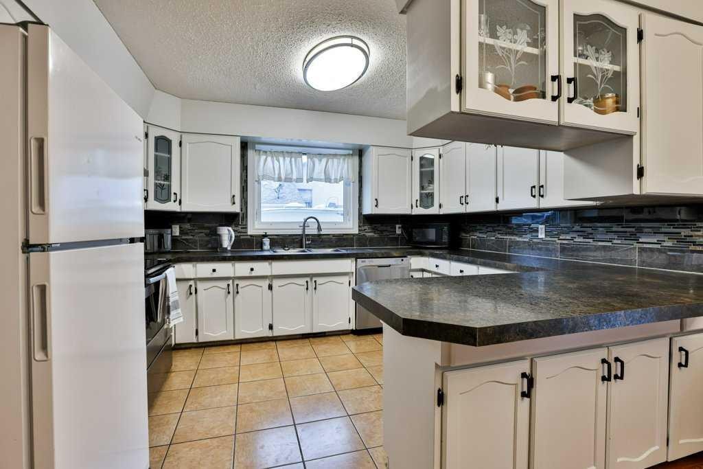5217 38 Avenue, Taber, AB - Indoor Photo Showing Kitchen With Double Sink