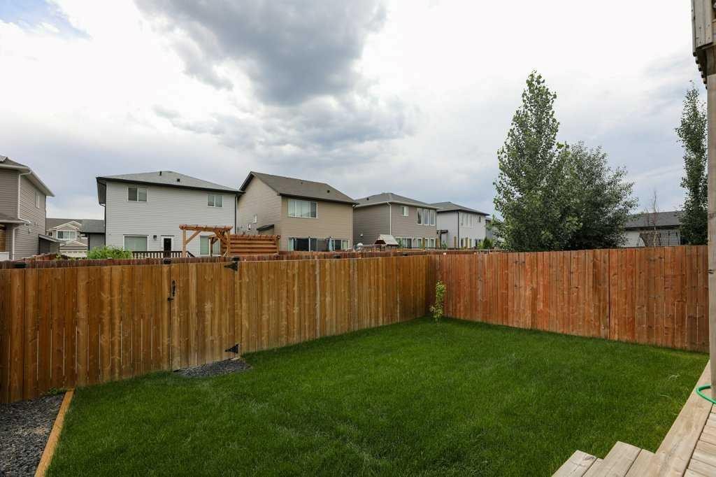 567 Moonlight Lane West, Lethbridge, AB - Outdoor With Backyard