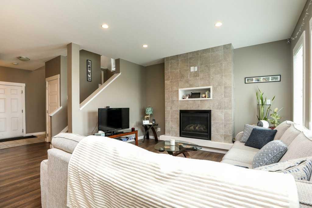 567 Moonlight Lane West, Lethbridge, AB - Indoor Photo Showing Living Room With Fireplace