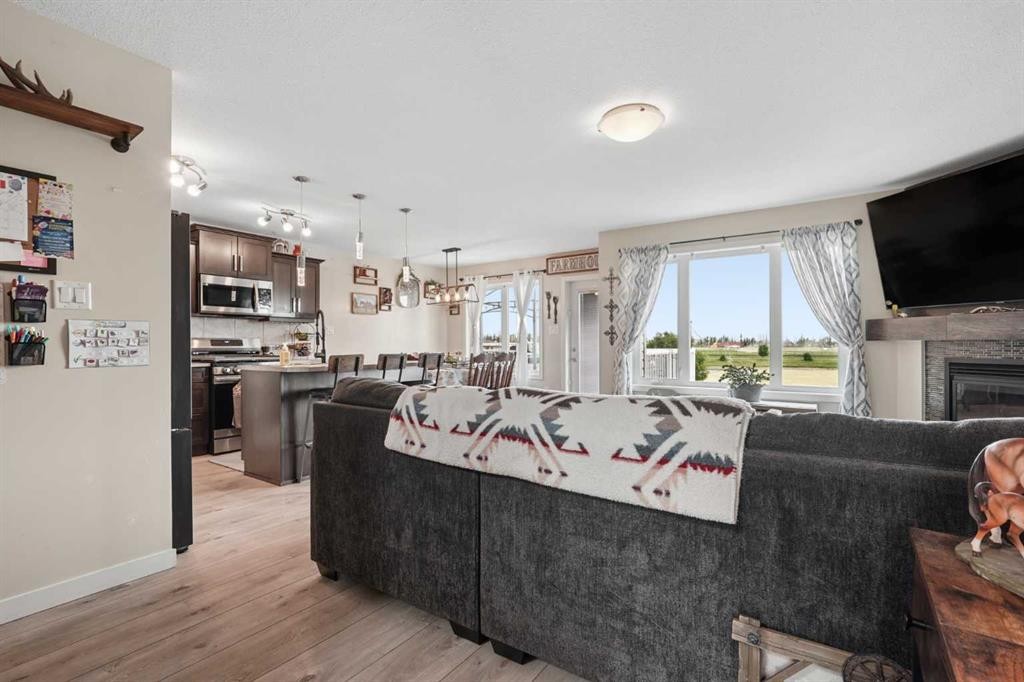 648 Parkside Green, Coaldale, AB - Indoor With Fireplace