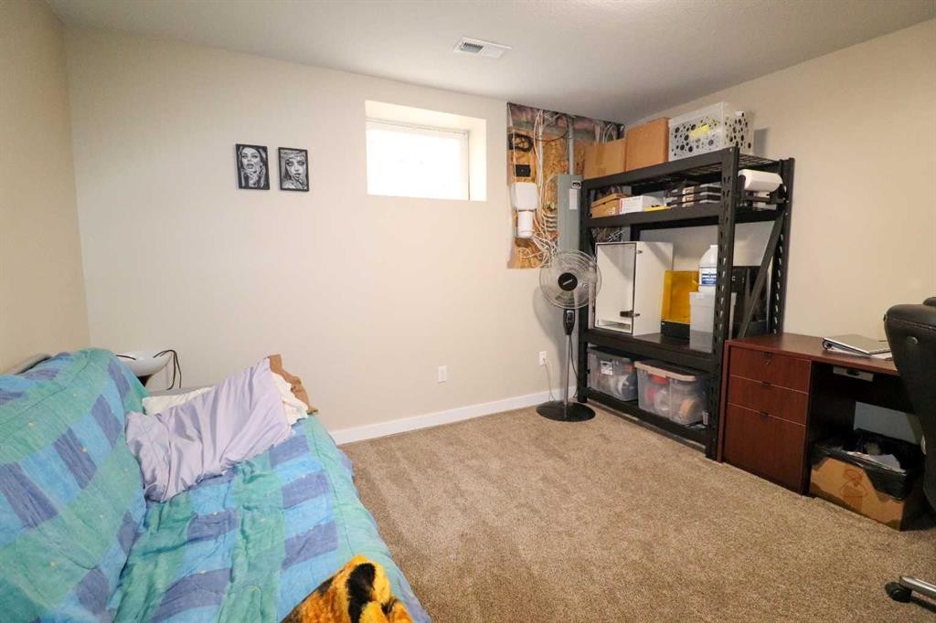 71 Coalbanks Gate West, Lethbridge, AB - Indoor Photo Showing Gym Room