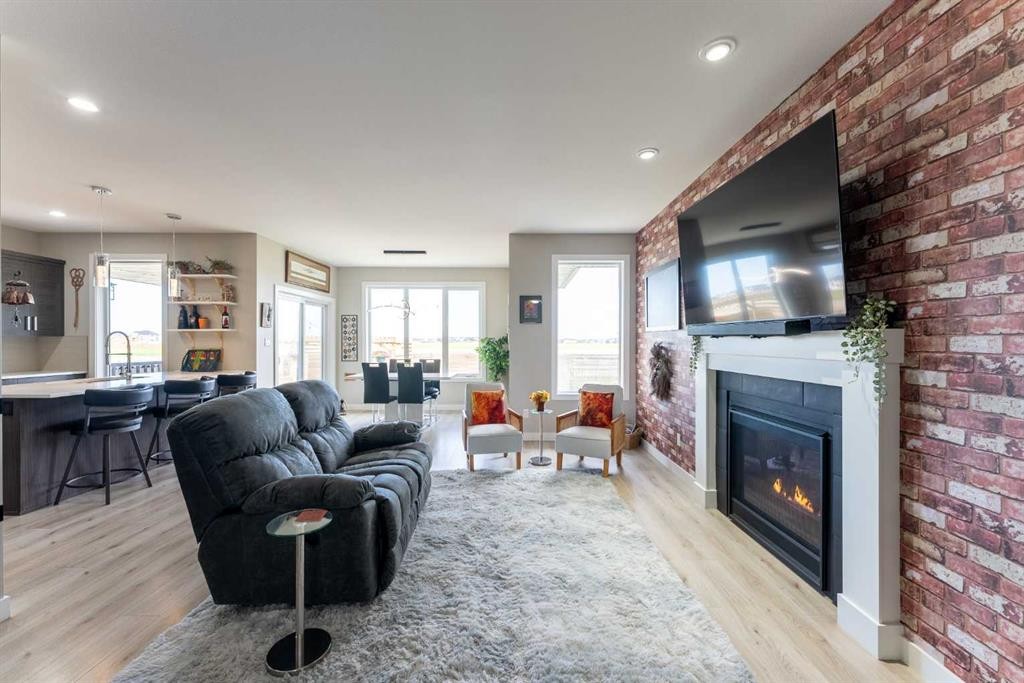 437 Devonia Way West, Lethbridge, AB - Indoor Photo Showing Living Room With Fireplace
