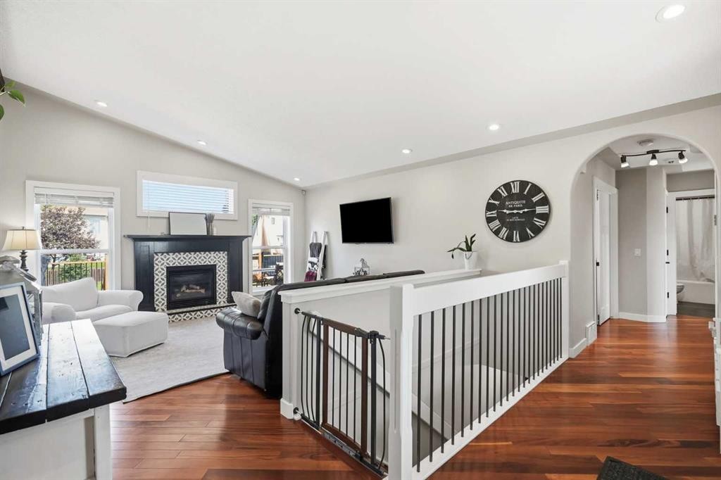 14 Lloyd Crescent Ne, Langdon, AB - Indoor Photo Showing Other Room With Fireplace