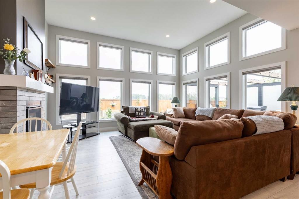 107 Westgate Drive, Coaldale, AB - Indoor Photo Showing Living Room With Fireplace