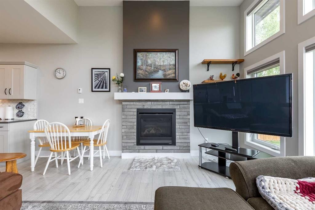 107 Westgate Drive, Coaldale, AB - Indoor Photo Showing Living Room With Fireplace